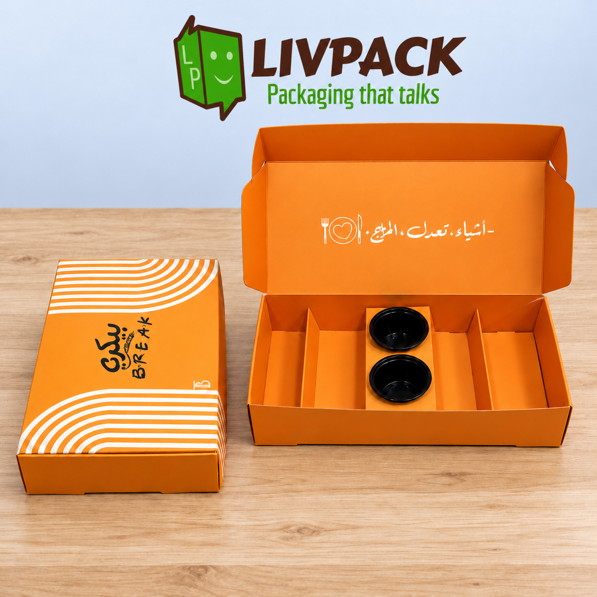 Boîte orange personnalisée 32 × 16 × 6 cm sur table bois avec logo LIVPACK vert et marron